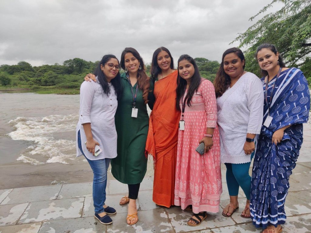 CloudMoyo employees at Snehwan School, posing together.